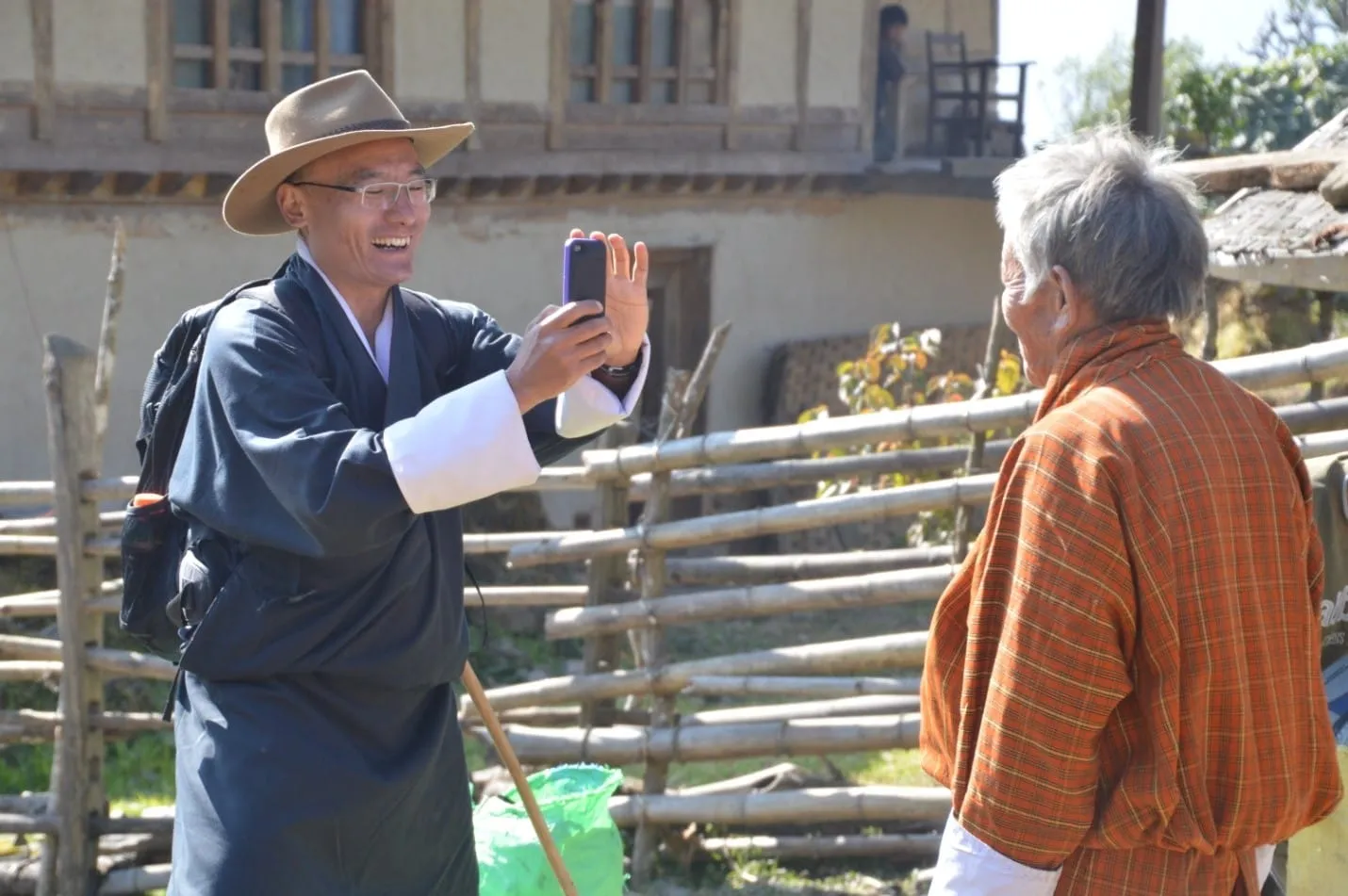 Prime Minister Tshering Tobgay takes a picture of a farmer during his country tour.