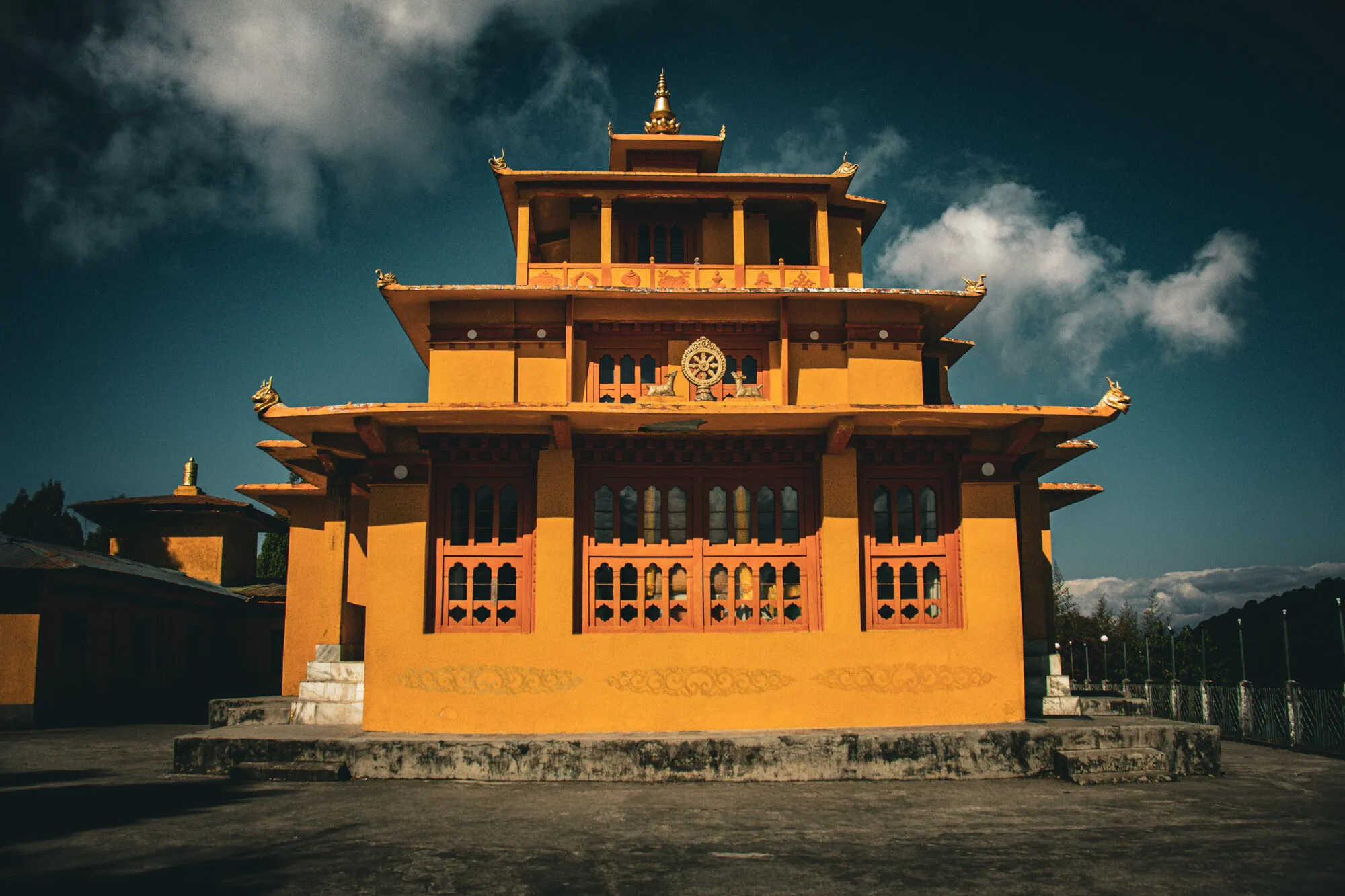 Thonphu Goenpa’s three-storey yellow Zangdopelri, with a golden Dharma wheel flanked by deer on the second storey and a golden finial